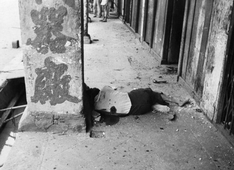 Civilians in an air raid shelter during a Japanese bombing raid